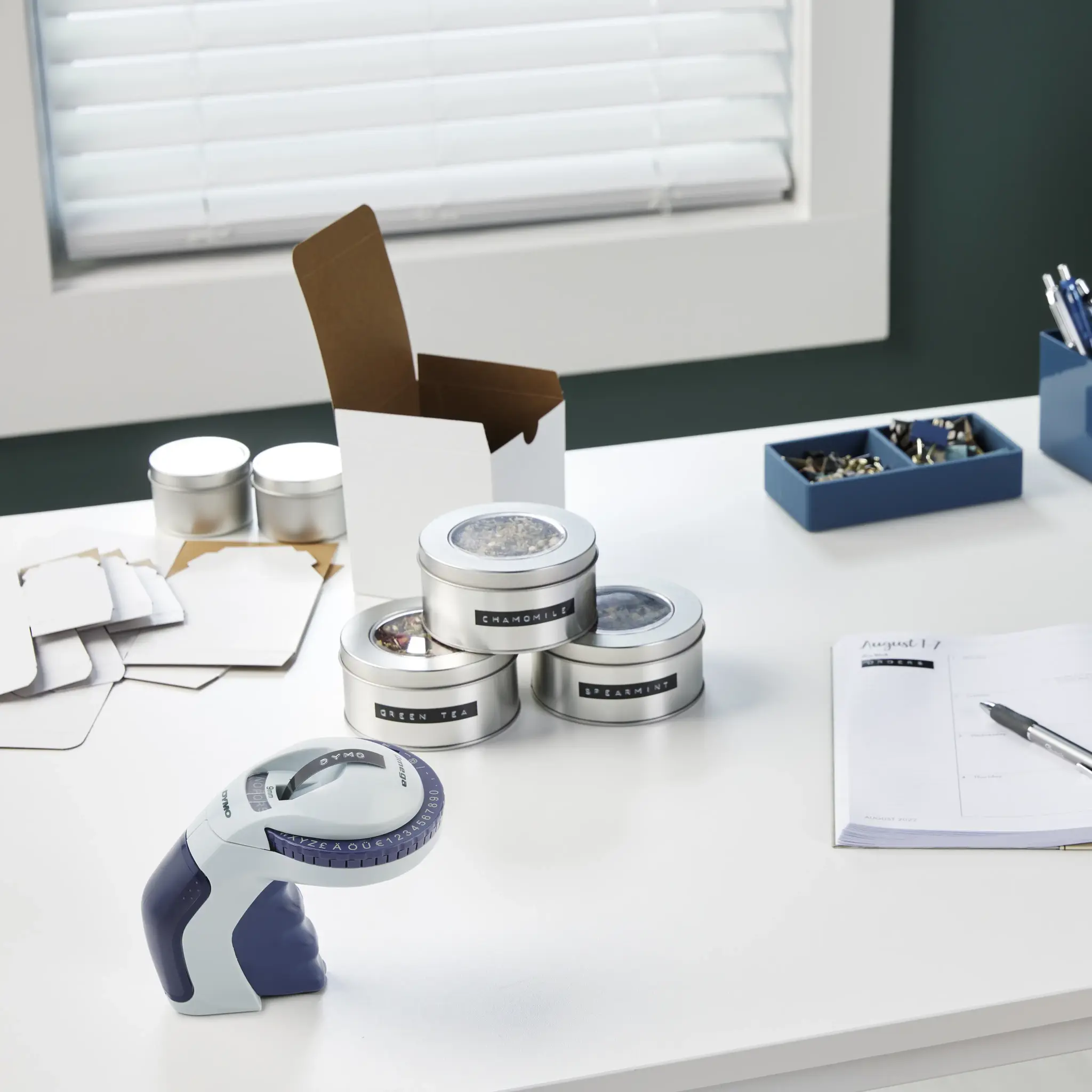 DYMO Omega Embossing Label Maker | Small Label Maker with Turn-Click Wheel and Ergonomic Design | For HomeDIY & Crafting (£/€ÄÖ & Ü), Direct thermal, Blue